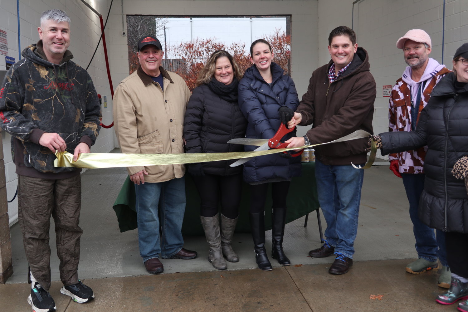 Greater Barryville Chamber of Commerce President John Pizzolato, left, holds the ceremonial ribbon as Matt Sallusto, with scissors prepares to cut the ribbon. To the right of Matt is his wife Elizabeth, mother Liz and father Jim.